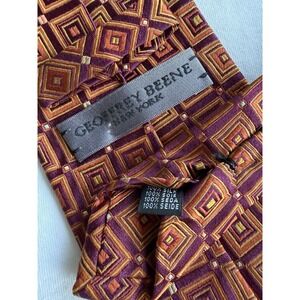 Geoffrey Beene	Burgundy Orange Psychedelic Geometric Woven Jacquard Silk Tie